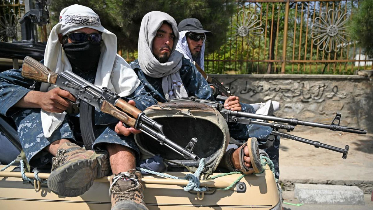  Taliban fighters patrol a street in Kabul. Credit: AFP Photo