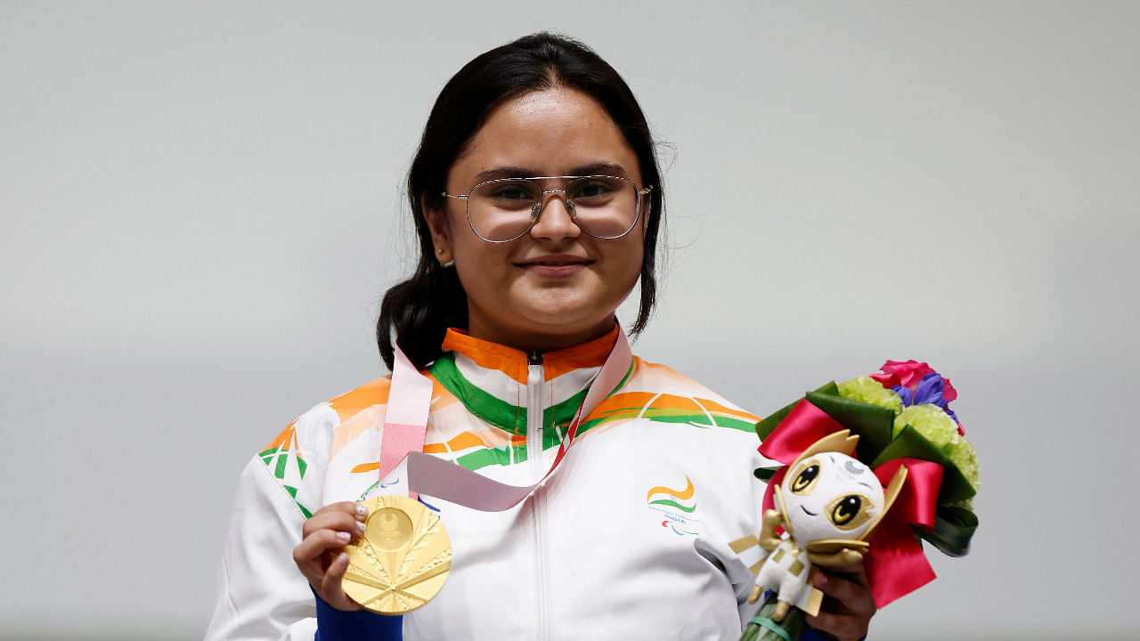 Gold Medallist Avani Lekhara of India celebrates on the podium. Credit: Reuters Photo