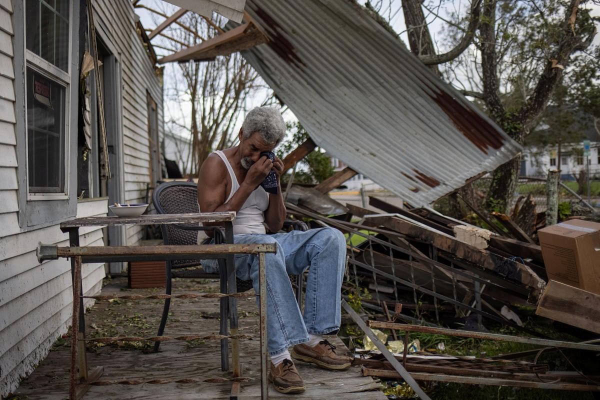 Theophilus Charles, 70, weeps while sitting on the front porch of his heavily damaged home in the aftermath of Hurricane Ida in Houma, Louisiana. Credit: Reuters Photo