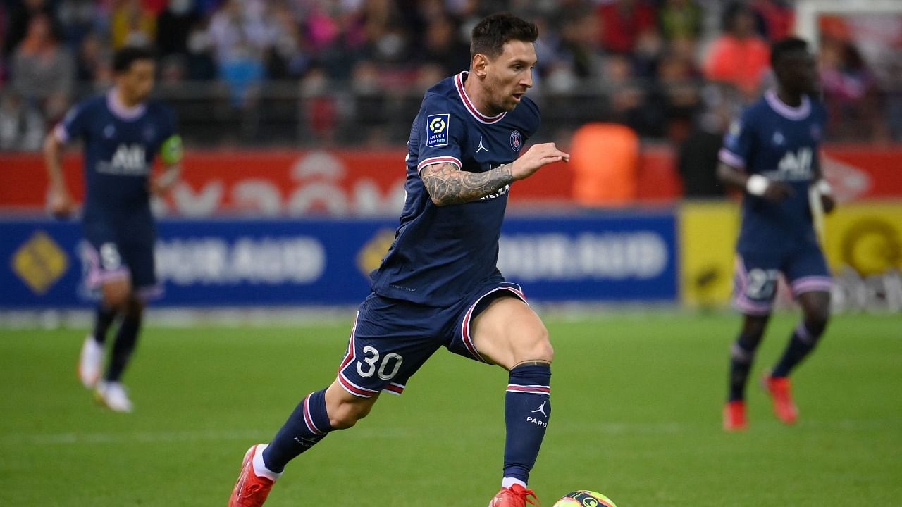 Paris Saint-Germain's Argentinian forward Lionel Messi runs with the ball during the French L1 football match between Stade de Reims and Paris Saint-Germain (PSG) at Stade Auguste Delaune in Reims. Credit: AFP Photo