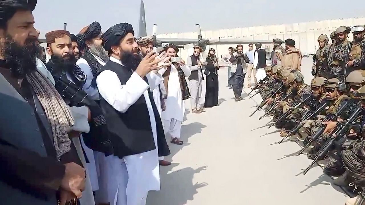 Taliban spokesman Zabihullah Mujahid speaks to Badri 313 military unit at Kabul's airport. Credit: Reuters Photo
