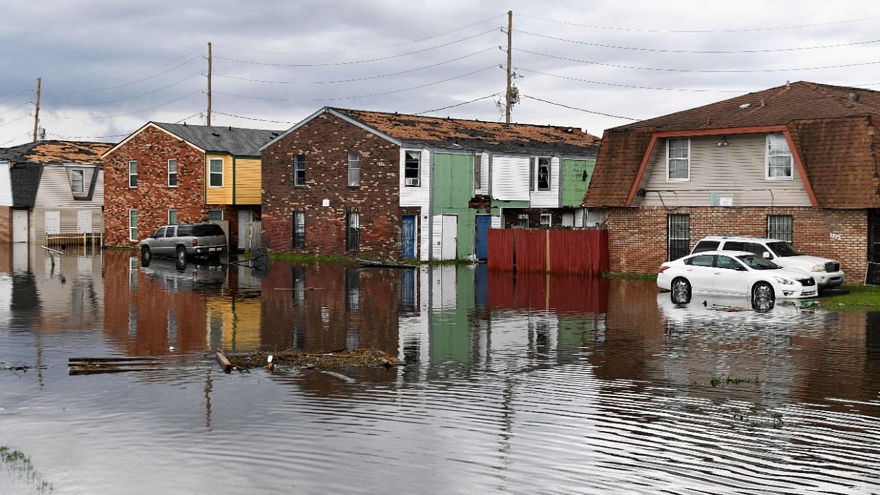 Homes stand partially flooded in LaPlace, Louisiana on August 30, 2021 in the aftermath of Hurricane Ida. Credit: AFP Photo