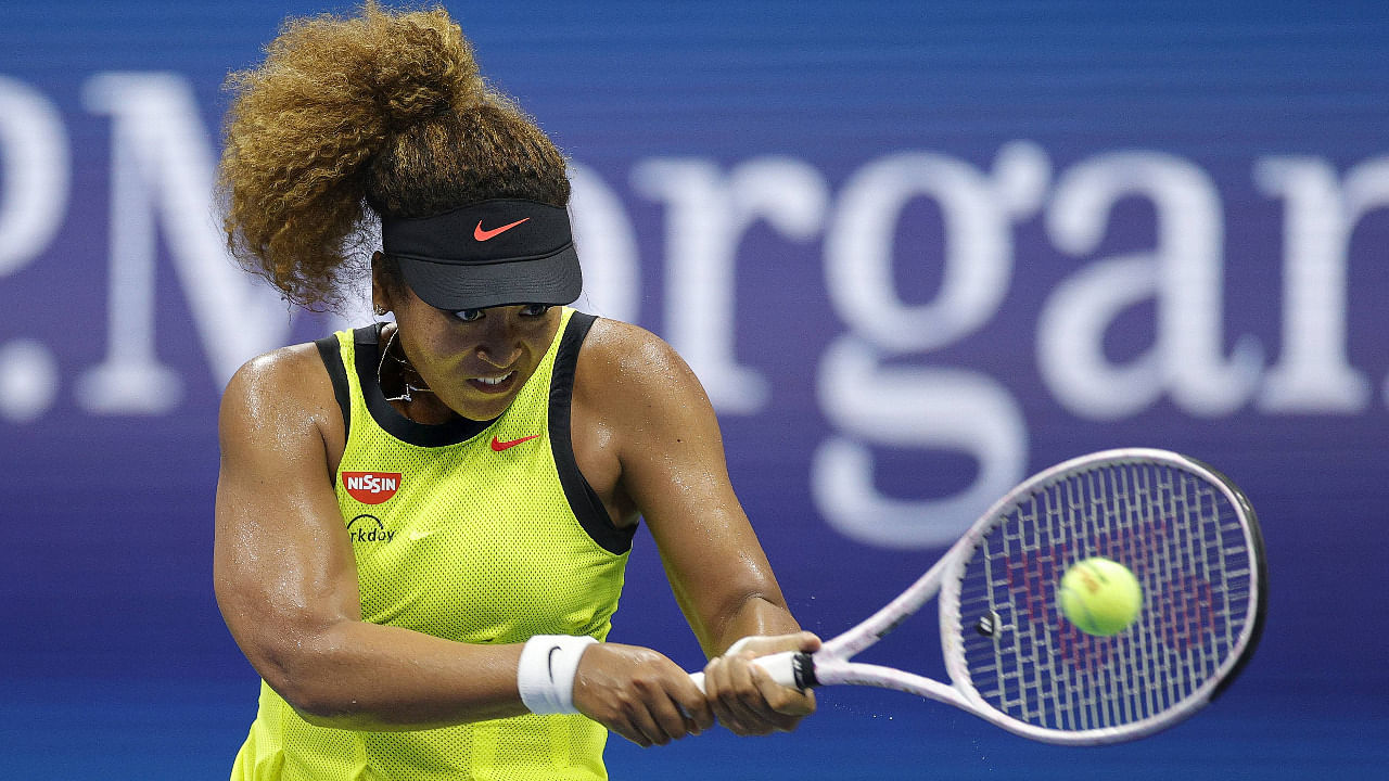 Naomi Osaka of Japan returns a shot against Marie Bouzkova of Czech Republic during their women's singles first round match on Day One of the 2021 US Open. Credit: AFP Photo