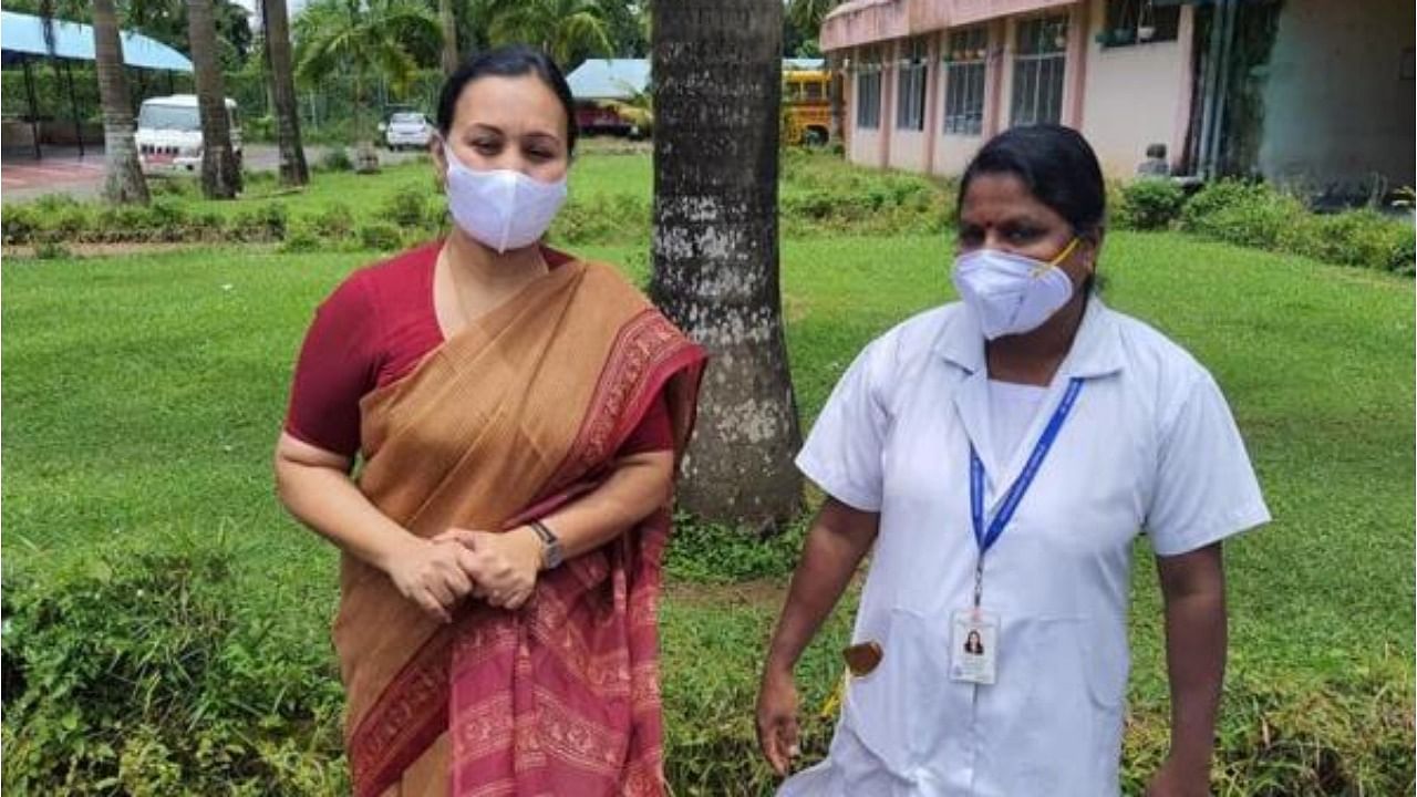 <div class="paragraphs"><p>Kerala Health Minister Veena George with a health worker. </p></div>