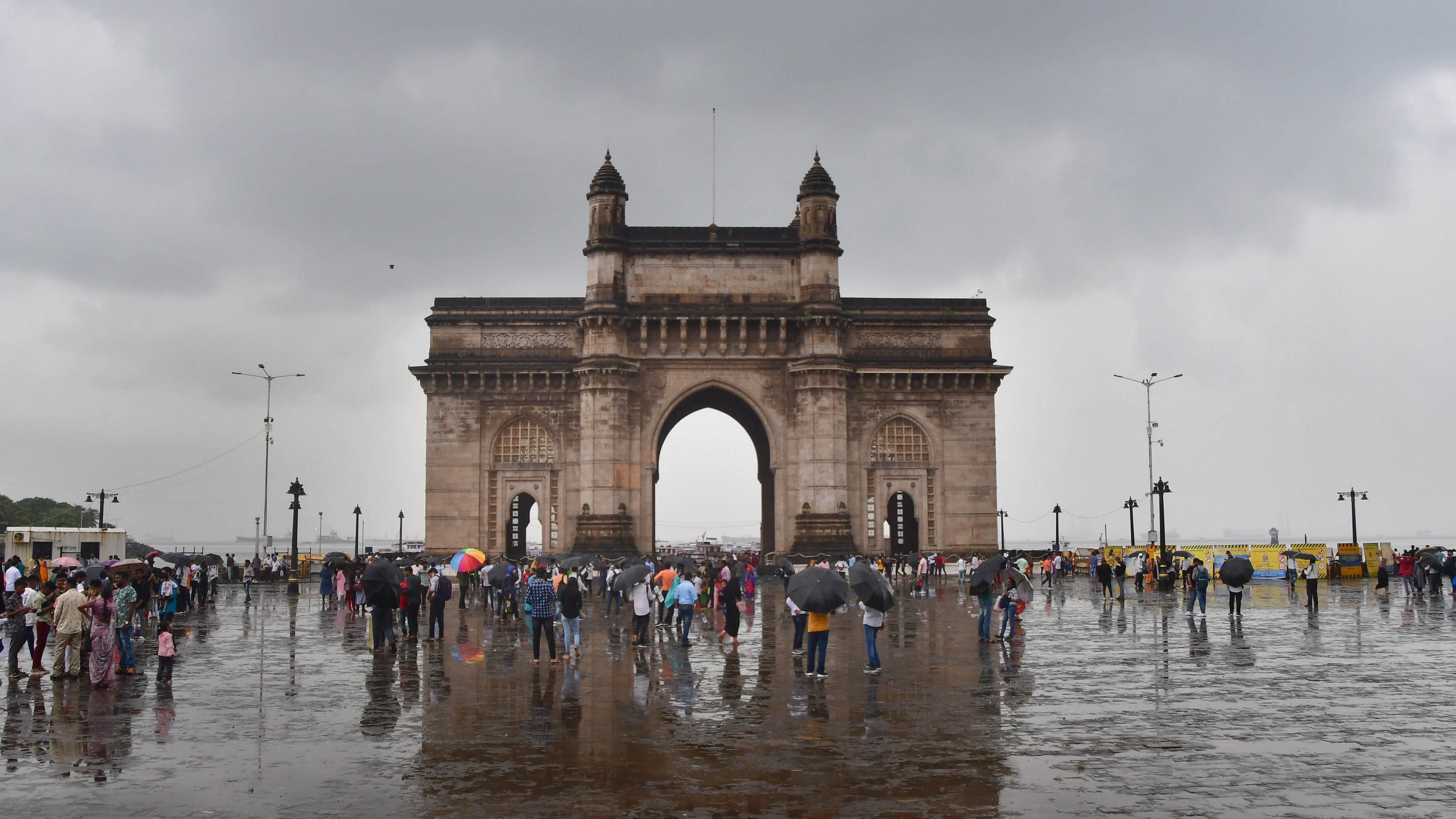 Reflection of Gateway of India on a puddle after rain in Mumbai. Credit: PTI