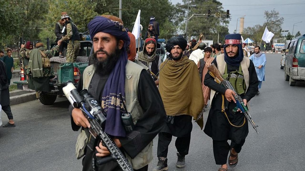 Taliban fighters gather along a street during a rally in Kabul on August 31, 2021 as they celebrate after the US pulled all its troops out of the country. Credit: AFP Photo