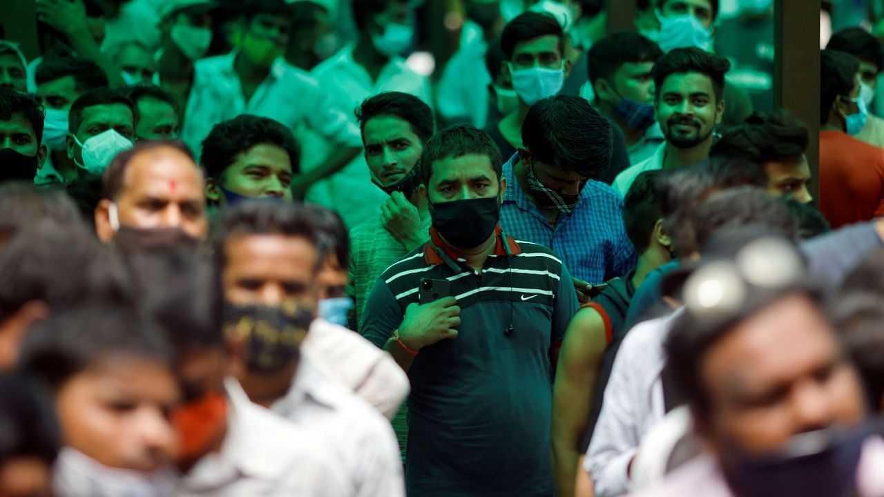 People wait to receive a dose of Covishield, a vaccine against coronavirus manufactured by Serum Institute of India, at a hospital in Noida on the outskirts of New Delhi, India, August 30, 2021. Credit: Reuters Photo
