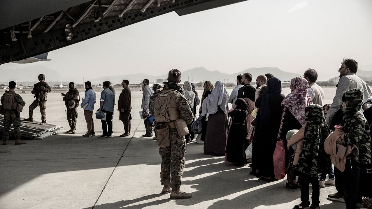 Evacuees at the Hamid Karazai International Airport. Credit: Reuters File Photo
