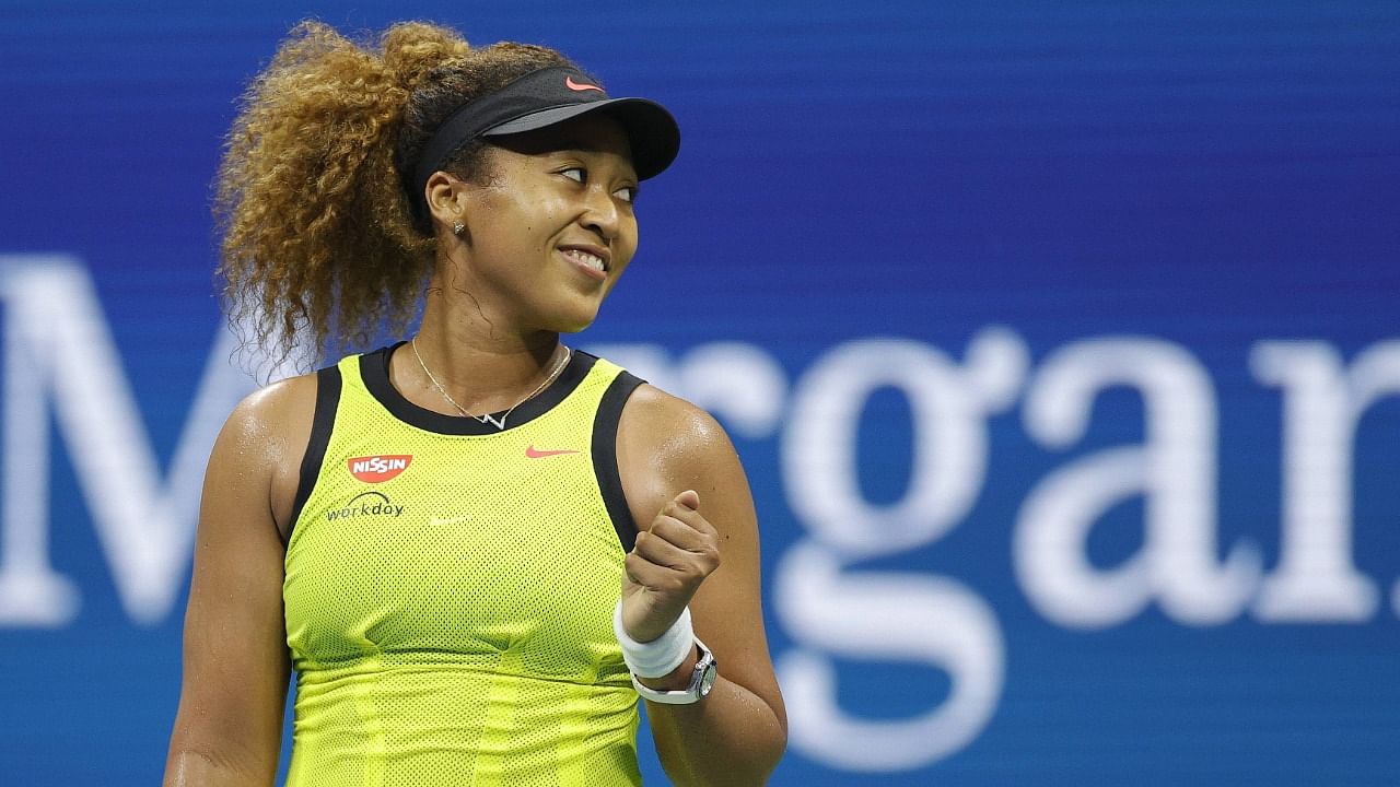 Naomi Osaka of Japan celebrates against Marie Bouzkova (not pictured) of the Czech Republic during their Women's Singles first round match on Day One of the 2021 US Open at the Billie Jean King National Tennis Center on August 30, 2021 in the Flushing neighborhood of the Queens borough of New York City. Credit: AFP Photo