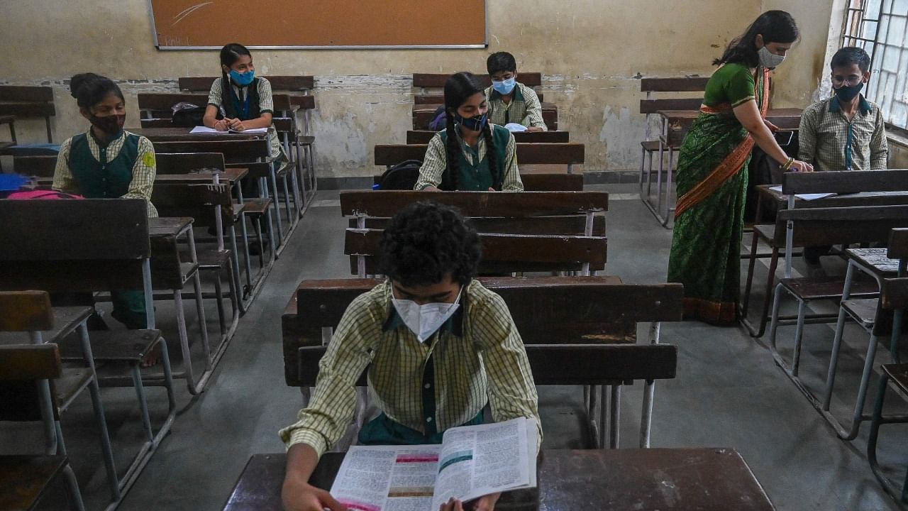 Standard 10th students attend a class at Sarvodya Co-Education senior secondary school in New Delhi. Credit: AFP Photo