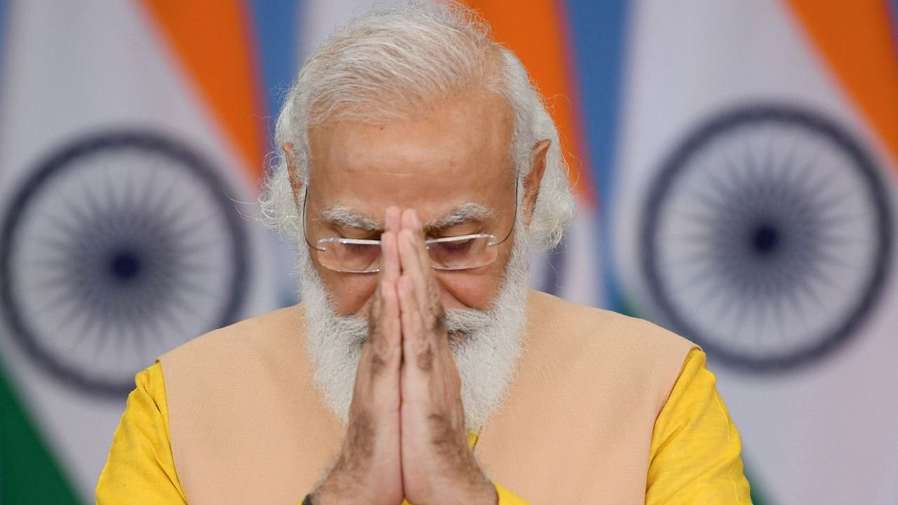 Prime Minister Narendra Modi during release of a special commemorative coin on the occasion of 125th Birth Anniversary of Srila Bhaktivedanta Swami Prabhupada, through video conferencing, in New Delhi, Wednesday. Credit: PTI Photo