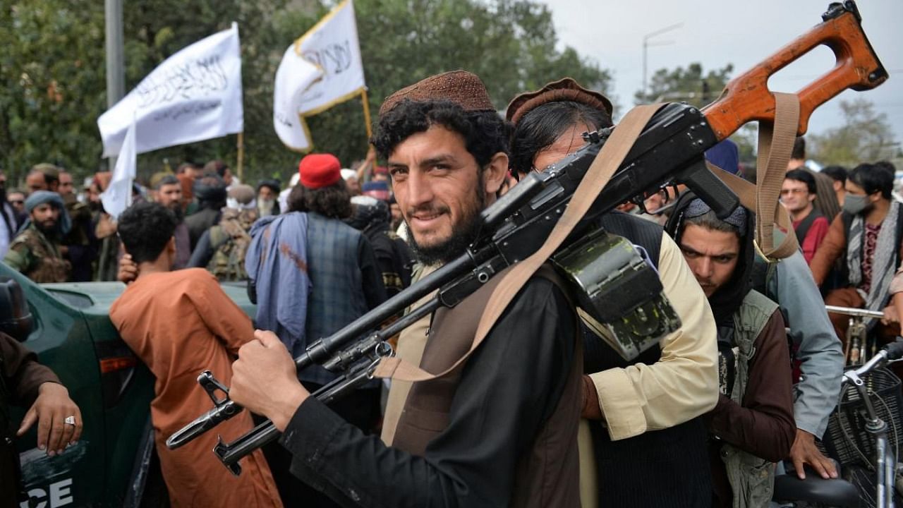 Taliban fighters gather along a street during a rally in Kabul on August 31, 2021 as they celebrate after the US pulled all its troops out of the country to end a brutal 20-year war. Credit: AFP Photo
