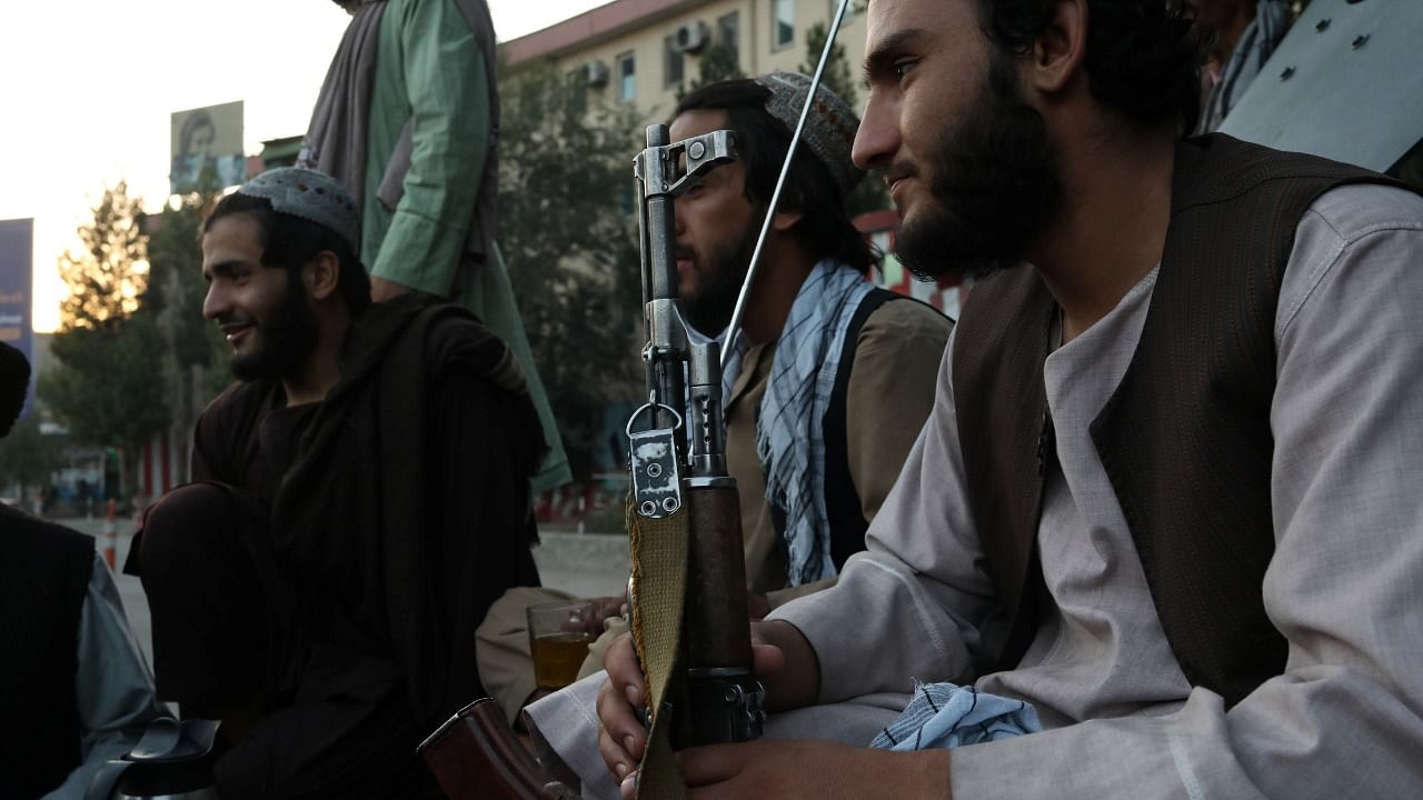 Taliban soldiers talk to each other, in Kabul, Afghanistan September 1, 2021. Credit: WANA (West Asia News Agency) via Reuters