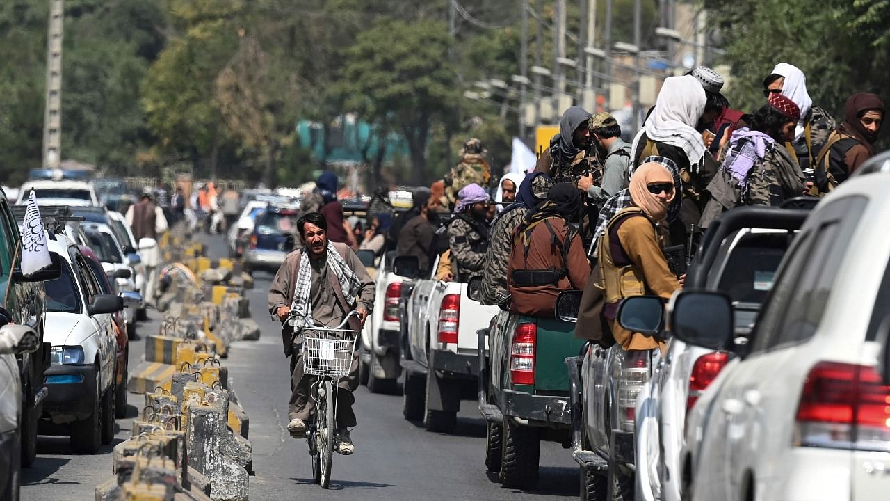 A convoy of Taliban fighters patrolling along a street in Kabul. Credit: AFP Photo