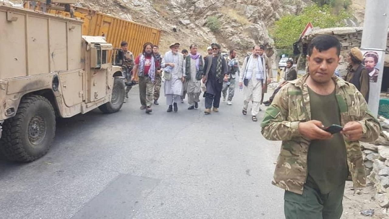 Anti-Taliban commanders walk on a road in Panjshir Valley, Afghanistan August 23, 2021. Credit: Reuters photo/Aamaj News Agency/File photo