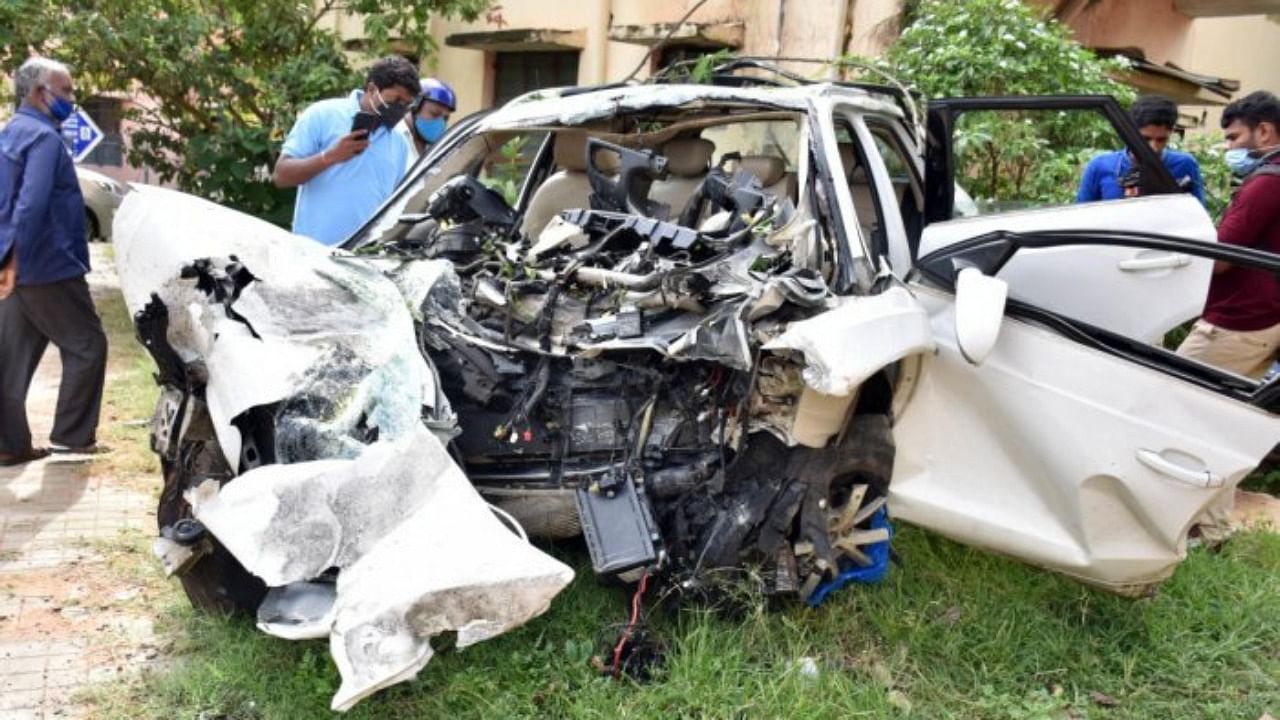 The police said that the SUV, being driven by one of the deceased, was crushed after the driver lost control, hit a pole and then rammed into a building near Mangala Convention Hall. Credit: DH Photo
