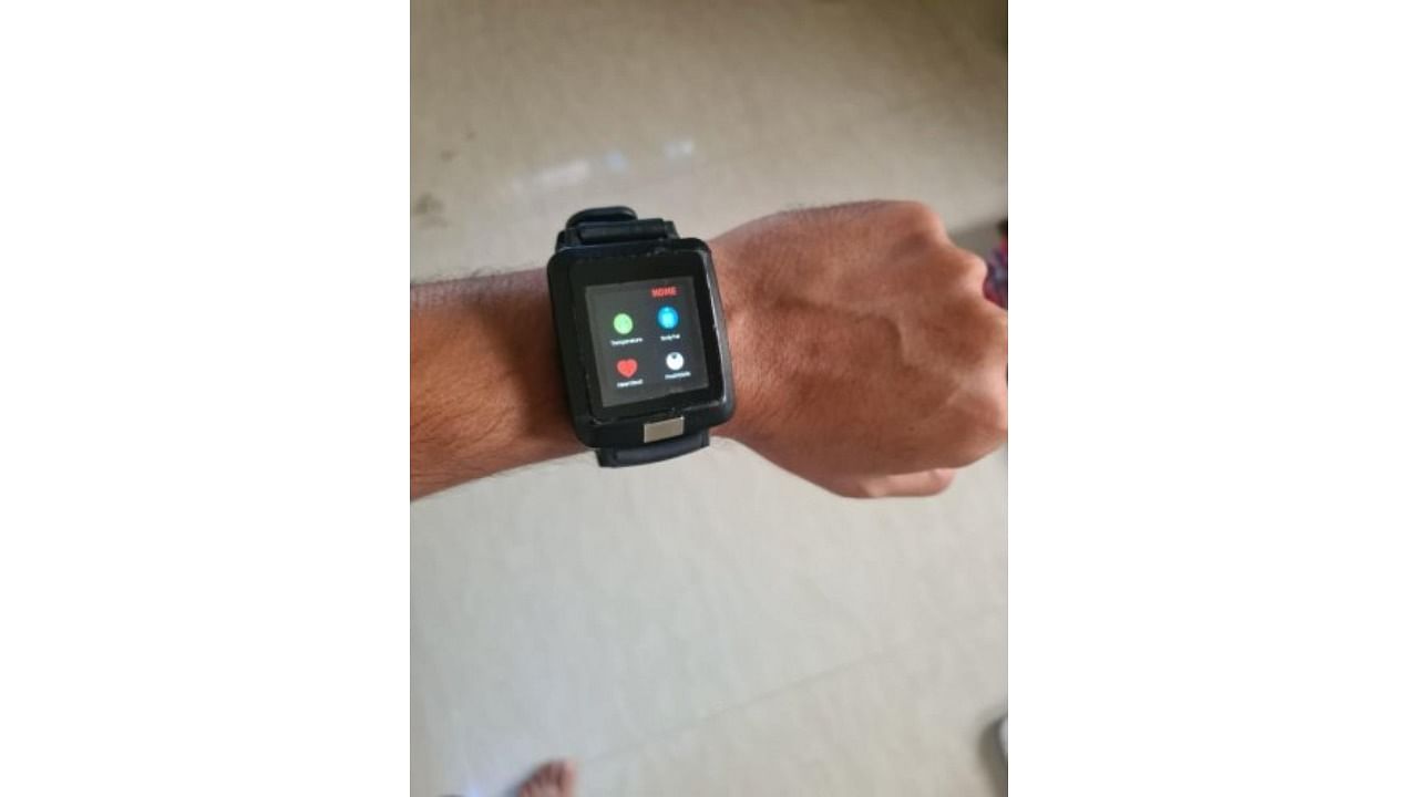 The device looks like a smartwatch, but comes with an additional leg band. Credit: DH Photo