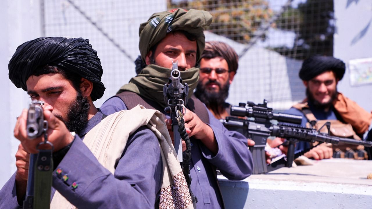 Taliban forces stand guard in Kabul. Credit: Reuters Photo