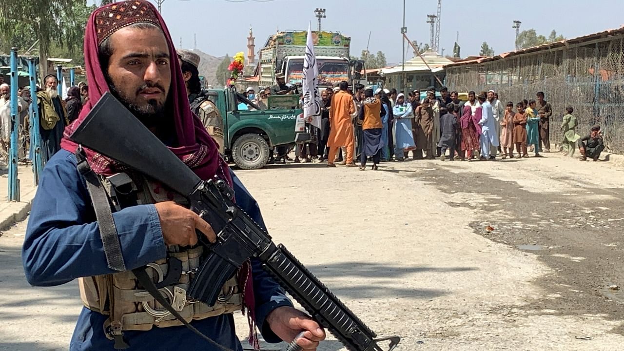 A member of the Taliban forces stands guard during an organised media tour to the Pakistan-Afghanistan crossing border, in Torkham. Credit: Reuters Photo