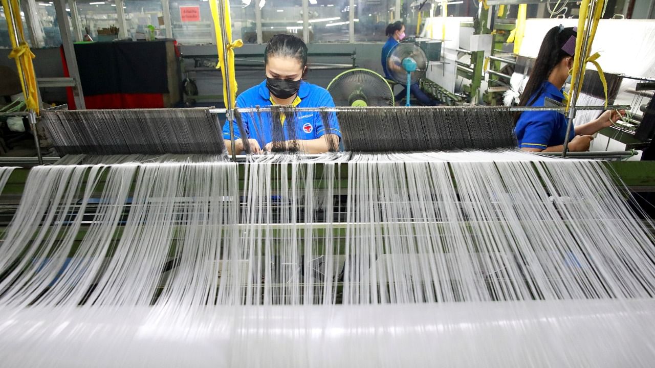 Millions of plastic bottles have been collected, shredded and turned into threads to be weaved into fabrics eventually used for PPE. Credit: Reuters Photo