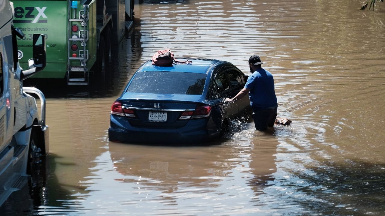 Cars sit abandoned on the flooded Major Deegan Expressway in the Bronx following a night of heavy wind and rain from the remnants of Hurricane Ida on September 2, 2021 in New York City. Credit: AFP Photo