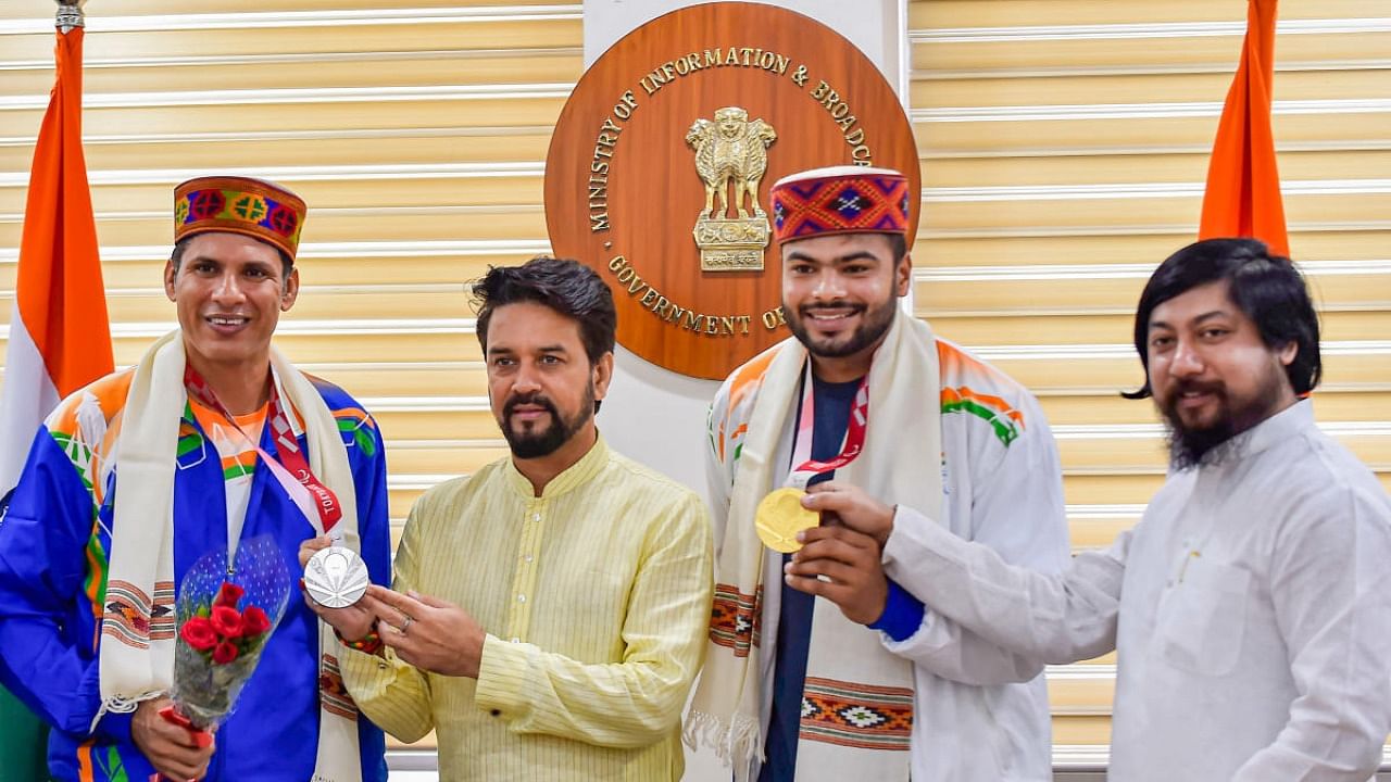 Union Minister for Youth Affairs and Sports Anurag Thakur and MoS Nitish Pramanik with medalists of the Tokyo Paralympics, Devendra Jhajharia and Sumit Antil during a felicitation function in New Delhi. Credit: PTI Photo