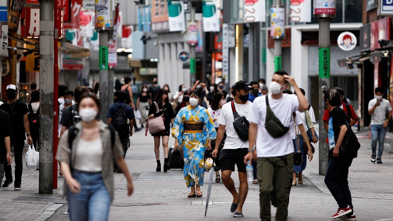 People walk in Shibuya shopping area, during a state of emergency amid the Covid-19 outbreak in Tokyo. Credit: Reuters Photo