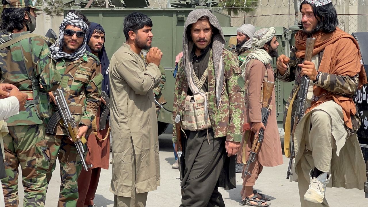 Taliban forces patrol at a runway. Credit: Reuters File Photo