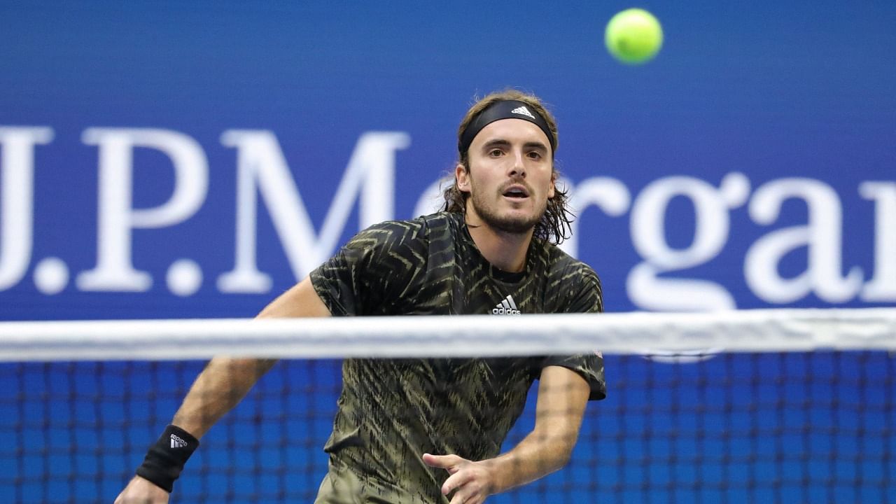 Greece's Stefanos Tsitsipas returns the ball to Spain's Carlos Alcaraz during their 2021 US Open Tennis tournament men's singles third round match at the USTA Billie Jean King National Tennis Center in New York, on September 3, 2021. Credit: AFP Photo