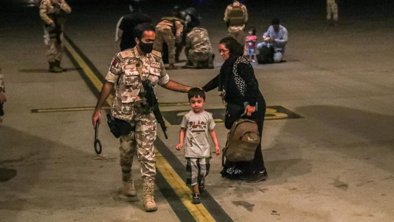 Evacuees from Afghanistan arrive at Al-Udeid airbase in Doha. Credit: Reuters file photo