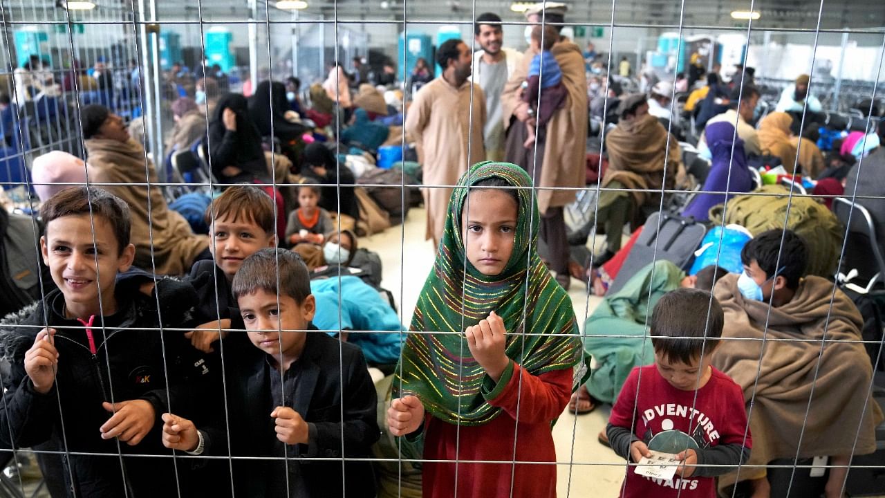 Air Force General Glen VanHerck, who heads US Northern Command, said there were more than 25,000 Afghan evacuees being housed at the eight bases as of Friday. Credit: AP/PTI Photo