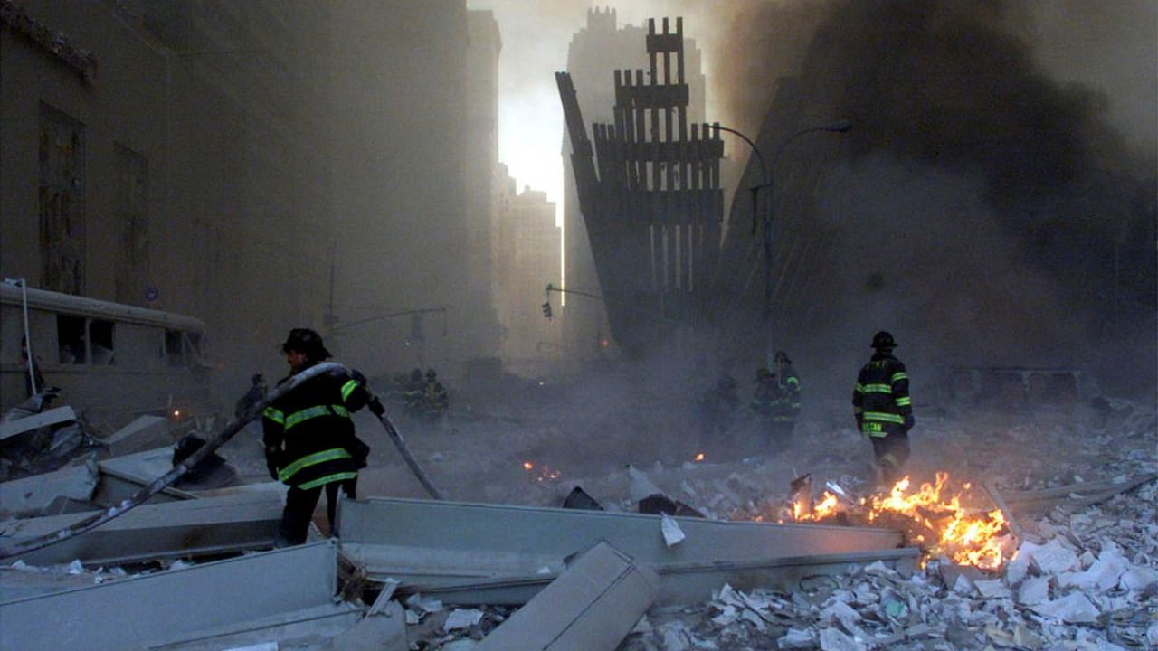 Firemen work around the World Trade Center after both towers collapsed in New York, U.S., September 11, 2001. Credit: Reuters Photo