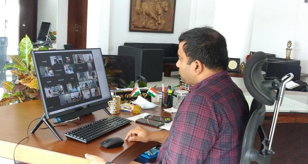 Dakshina Kannada Deputy Commissioner Dr Rajendra K V, at a video conference with Zilla Panchayat CEO, DHO Dr Kishore, taluk health officers, Gram Panchayat development officers and village accountants, in his chambers on Friday.