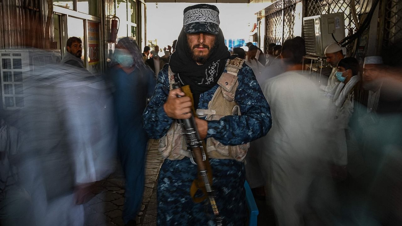 A Taliban fighter stands guard. Credit: AFP Photo