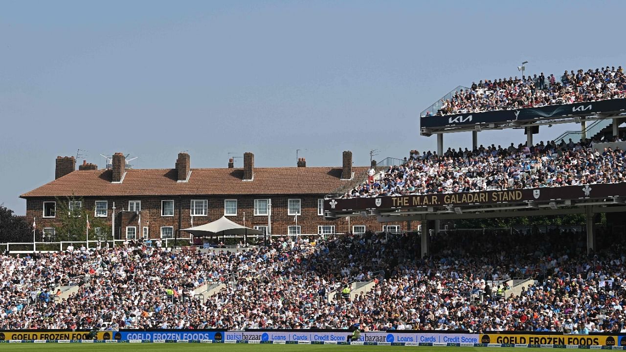 Fans in the packed grandstands watch in the sunshine on the day 4 of the fourth Test match between England and India at the Oval cricket ground in London. Credit: AFP Photo