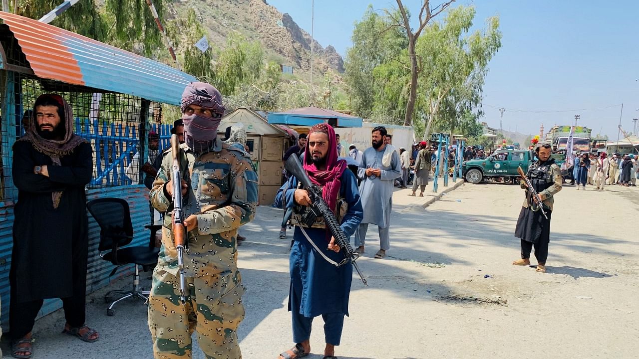 Members of the Taliban force stand guard. Credit: Reuters Photo