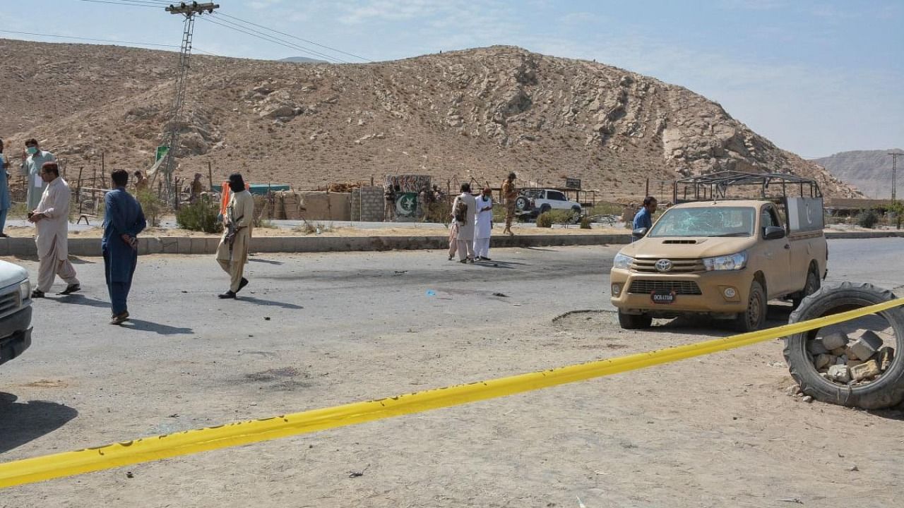 Security personnel examine the site of a blast after a suicide bomber on a motorbike blew himself up near a checkpoint in the southwestern city of Quetta. Credit: AFP Photo