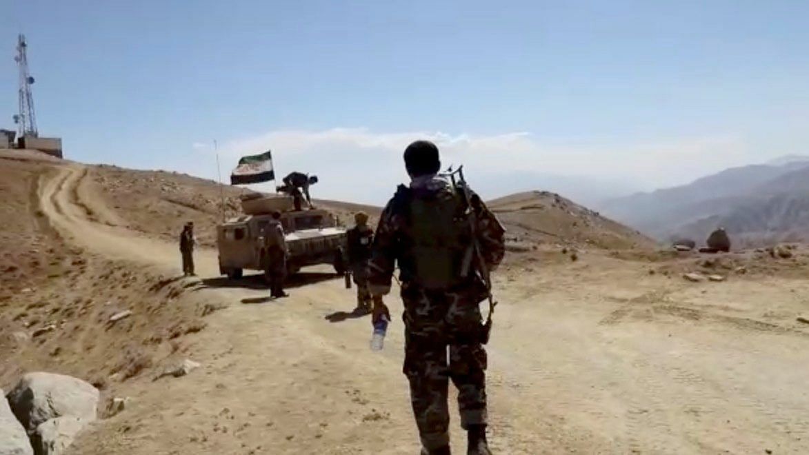 A humvee with National Resistance Front flag is seen in front of a radio mast near Panjshir Valley, Afghanistan in this still image obtained from an undated video handout. Credit: National Resistanace Front of Afghanistan handout via Reuters