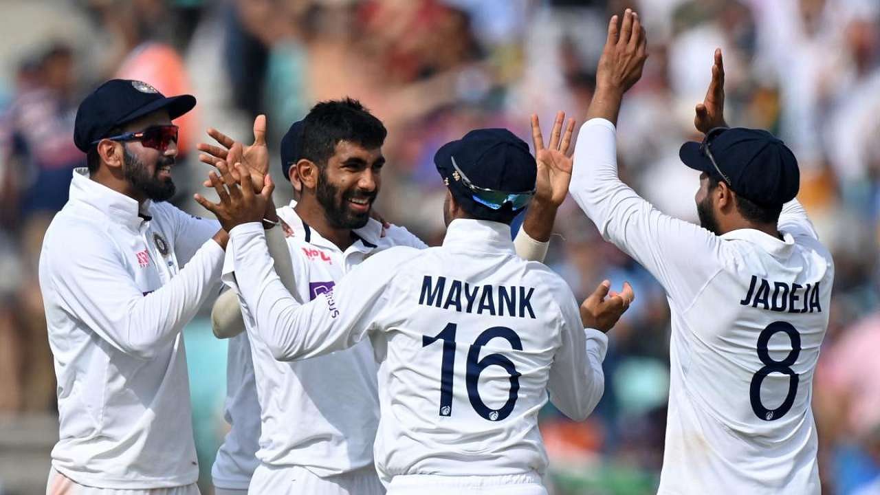 Jasprit Bumrah (2L) celebrates taking the wicket of England's Jonny Bairstow during play on the fifth day of the fourth cricket Test match between England and India at the Oval cricket ground in London. Credit: AFP Photo