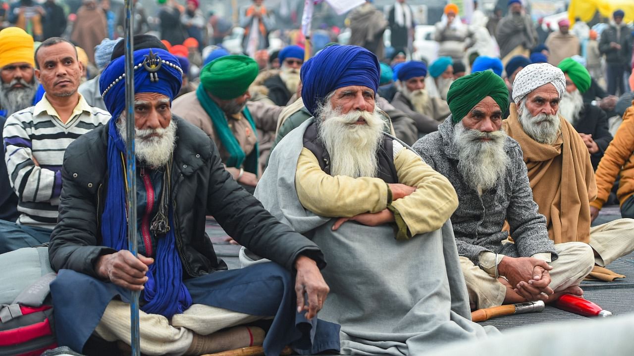 Farmers during the ongoing protest against the new farm laws, at Singhu Border in New Delhi. Credit: PTI File Photo
