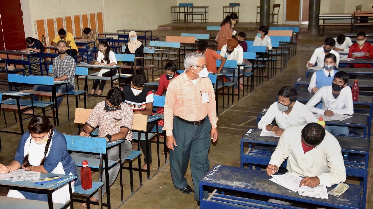 Students appear in the special exams for higher secondary conducted for those students who were not satisfied with the declared results of MPBSE, in Bhopal. Credit: PTI Photo