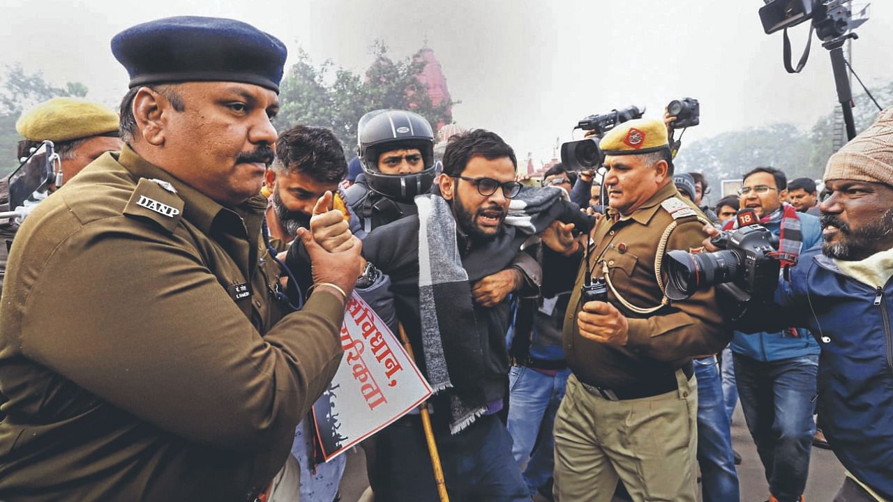 Former JNU student and activist Umar Khalid being detained by the police. Credit: PTI File Photo