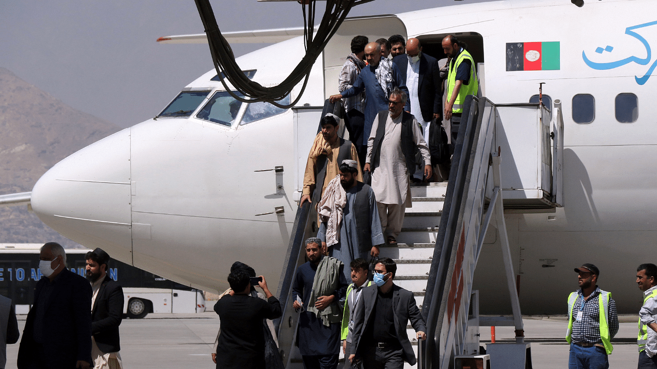 Passengers disembark as they arrive from Kandahar, at Hamid Karzai International Airport in Kabul. Credit: AP Photo