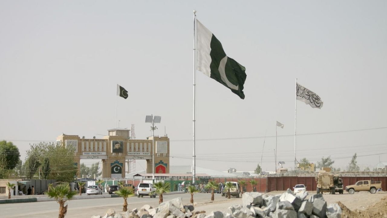 General view of Pakistan and Taliban flags at the Friendship Gate crossing point in the Pakistan-Afghanistan border town of Chaman. Credit: Reuters Photo