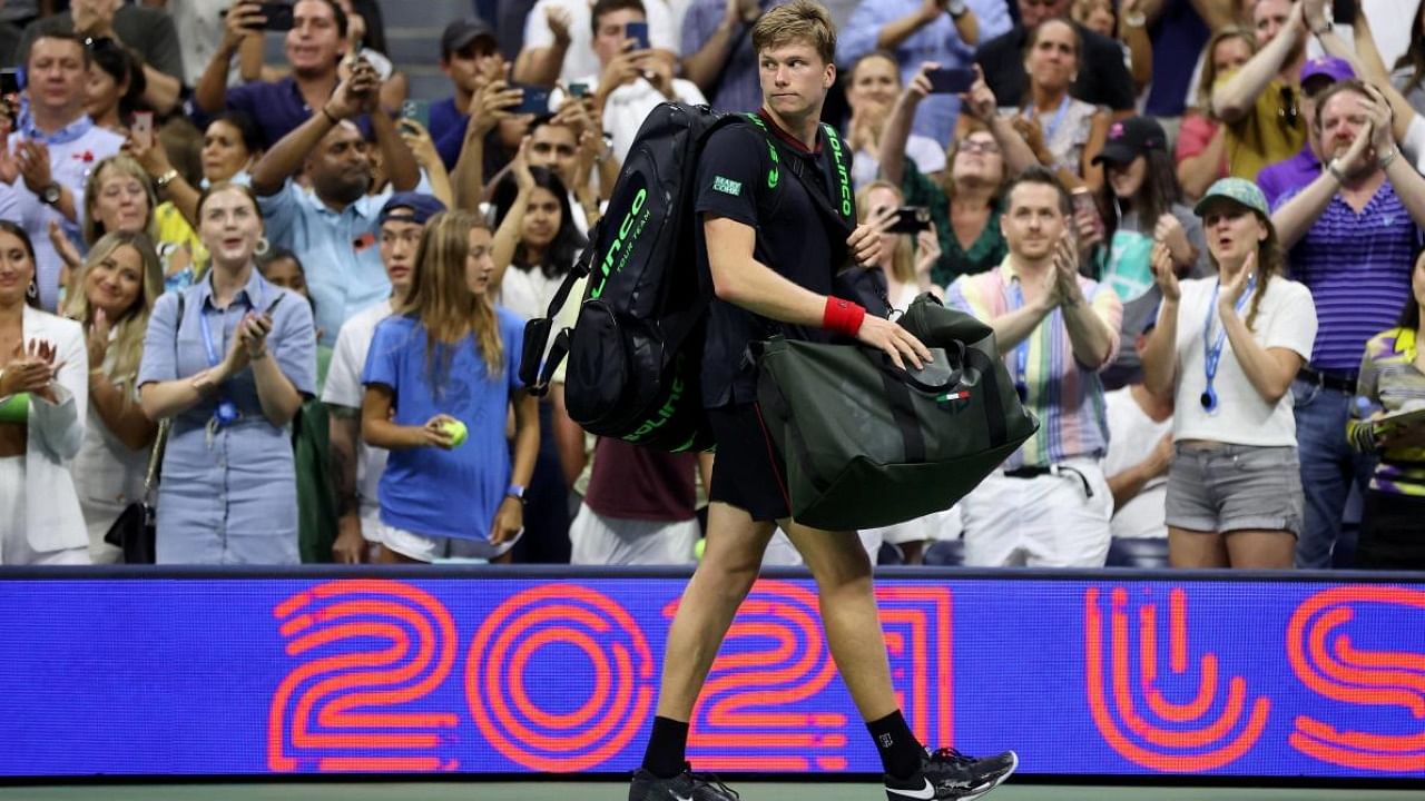 Jenson Brooksby of the United States walks off court after being defeated by Novak Djokovic of Serbia. Credit: AFP Photo
