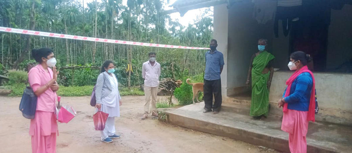 Asha and anganwadi workers and health department personnel inquire about the health of plantation labourers in Bettageri.