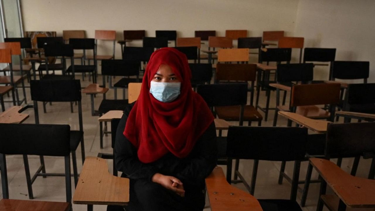 Women can only attend class if they wear an abaya -- a flowing robe -- and a niqab -- a face veil with a small window to see through -- and are separated from men. Credit: AFP Photo