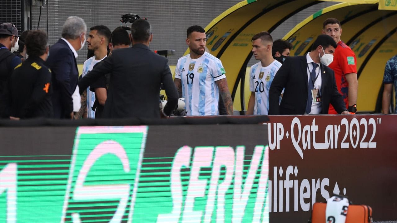 Argentina's Nicolas Otamendi and teammates walk off the pitch as play is interrupted after Brazilian health officials objected to the participation of three Argentine players they say broke quarantine rules. Credit: Reuters Photo