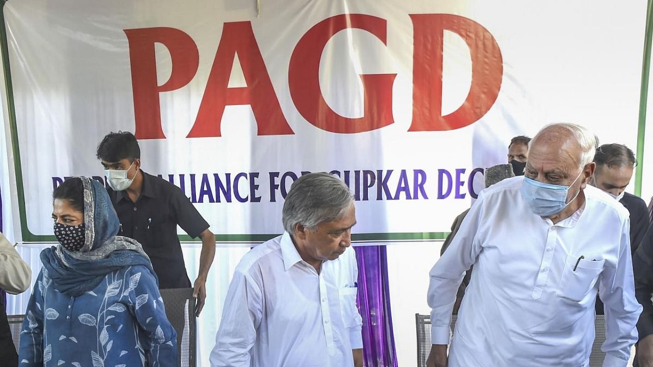 People's Alliance for Gupkar Declaration (PAGD) Spokesman M Y Tarigami with National Conference President Farooq Abdullah (R), Peoples Democratic Party (PDP) President Mehbooba Mufti (L) during a press conference after a meeting, in Srinagar. Credit: PTI photo