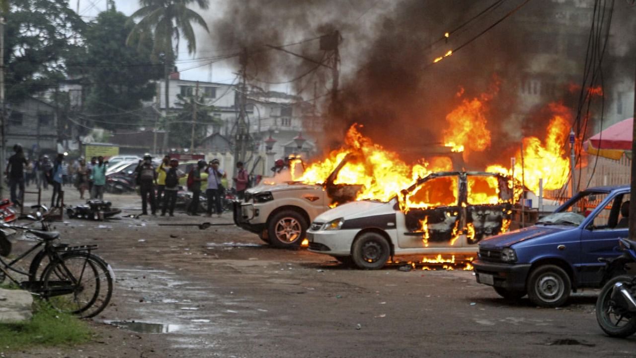 Vehicles in flames after clashes between BJP supporters and CPI(M) activists, in Agartala. Credit: PTI photo
